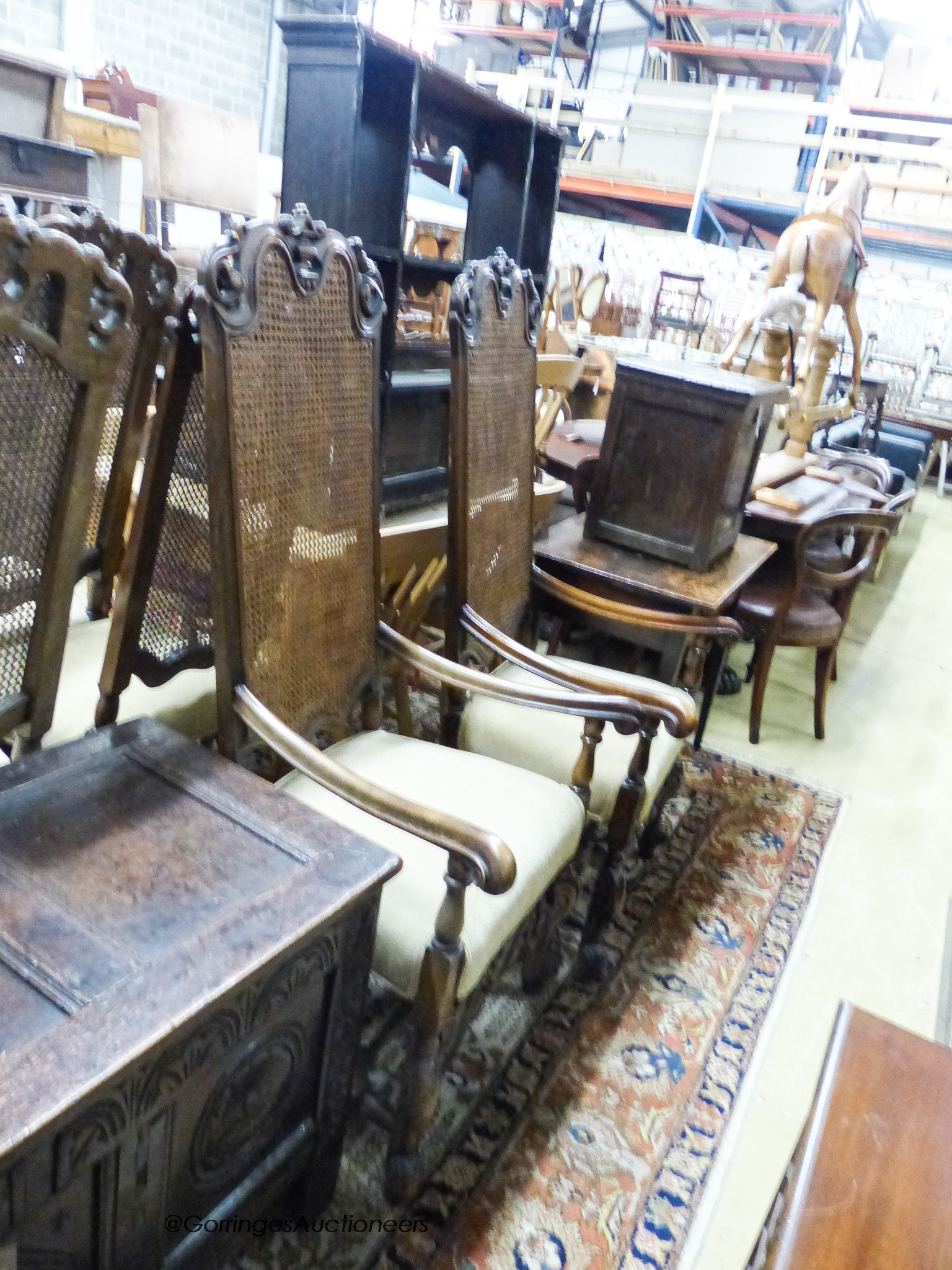 A set of eight William and Mary style walnut dining chairs